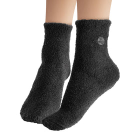 Earth Therapeutics socks used in a nighttime routine to keep feet soft while sleeping
