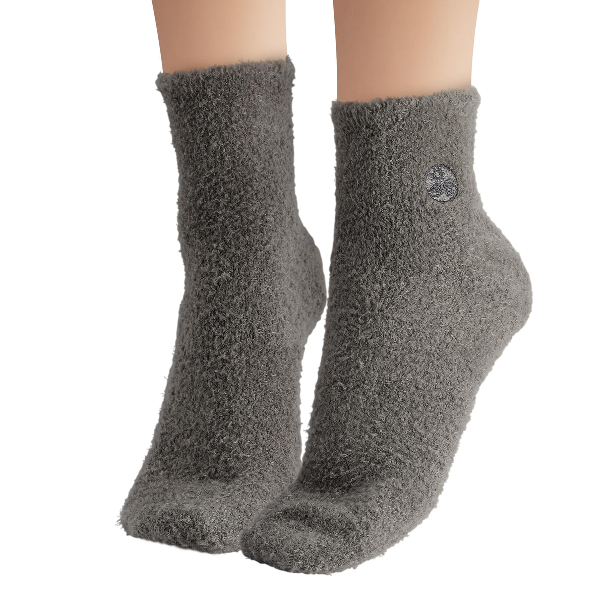 Earth Therapeutics socks worn on feet demonstrating cushioned comfort and lotion retention