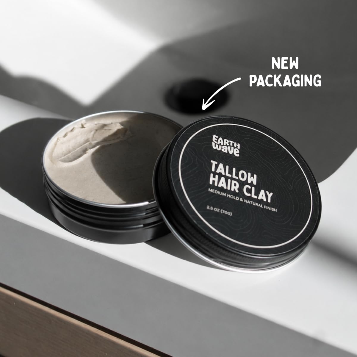 Earth Wave clay warmed in hand demonstrating easy application and even distribution