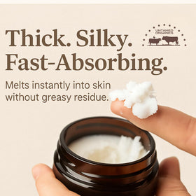 Earthborn Organics balm being rubbed between fingers demonstrating quick melt and hydration