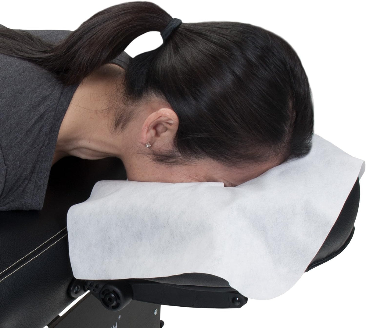 EarthLite placed on a massage table headrest showing secure, wrinkle-free fit