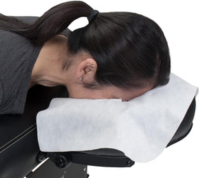 EarthLite placed on a massage table headrest showing secure, wrinkle-free fit