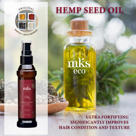 Applying Earthly Body oil to palms and hair to tame frizz and add smoothness