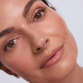EarthsCure highlighter stick sheen detail demonstrating soft radiance boost