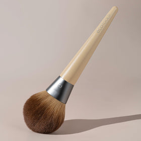 EcoTools brush being cleaned with brush shampoo to maintain softness and performance
