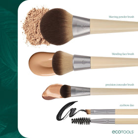 EcoTools brush next to a hand for scale to show full-size coverage capacity