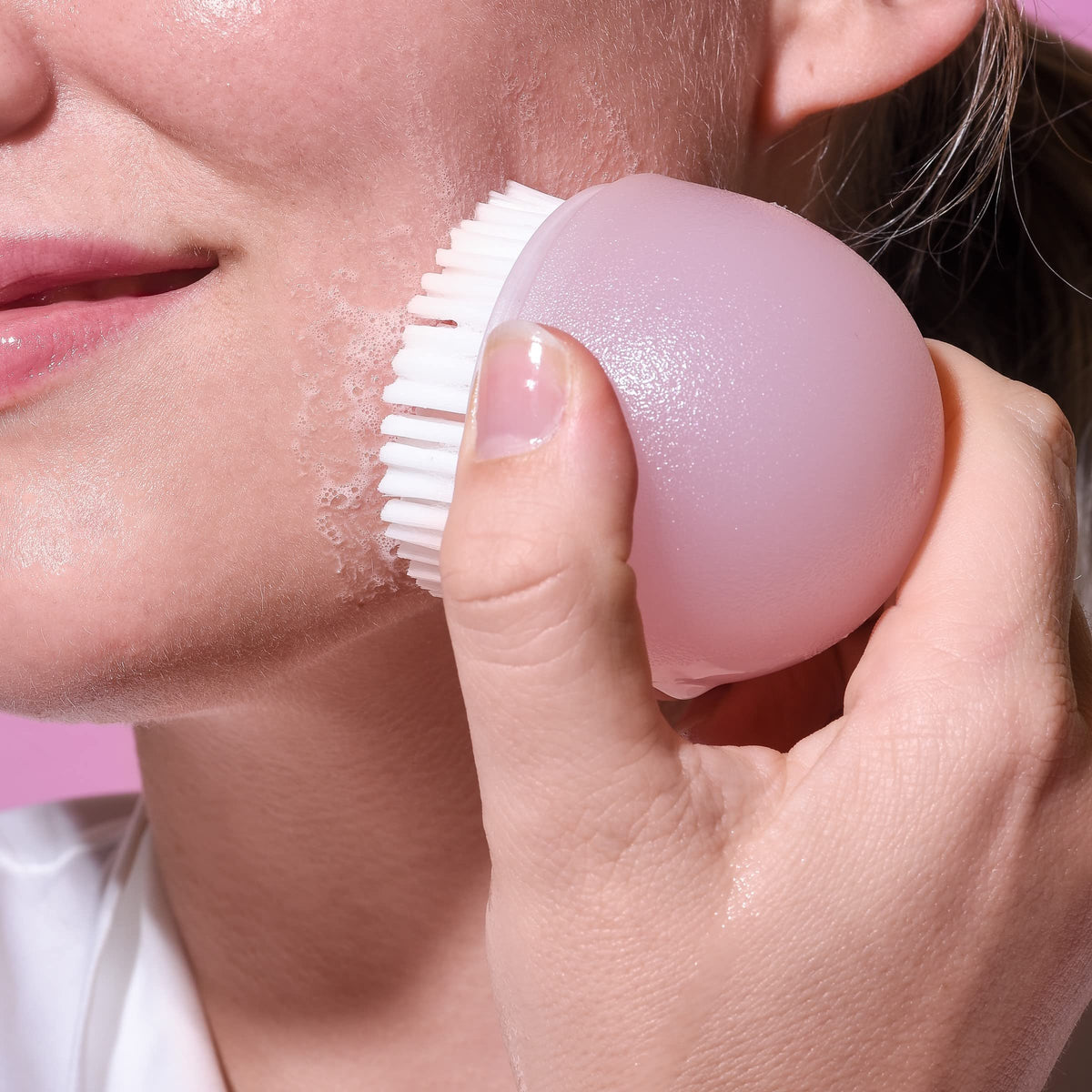 EcoTools brush producing cleanser foam to enhance cleansing benefit