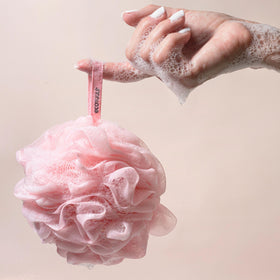 EcoTools pouf making rich lather with body wash for effective cleansing benefit
