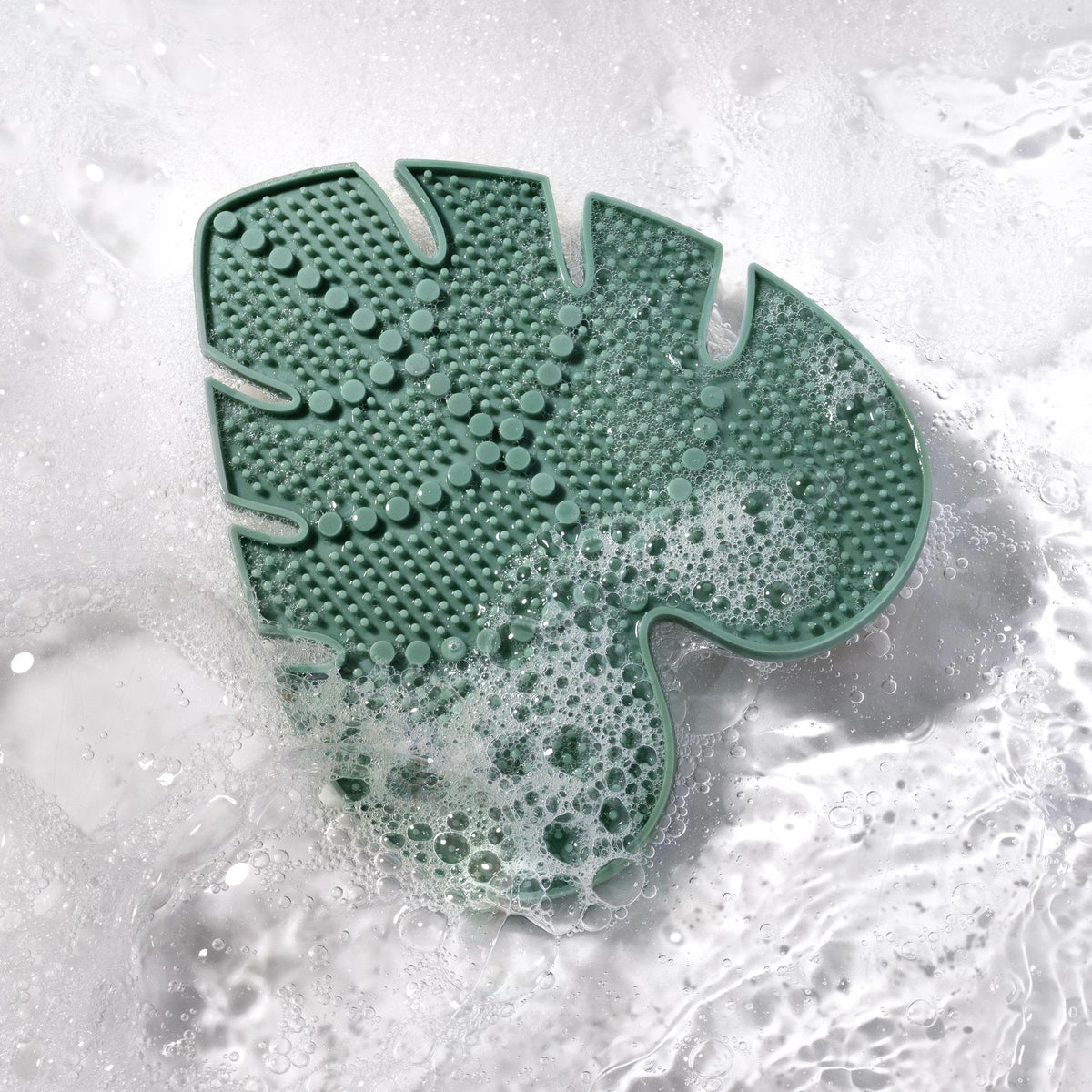 EcoTools pad producing foam with shampoo for thorough lather and quicker rinsing