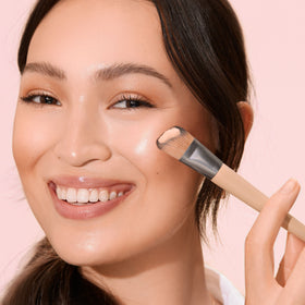 EcoTools brush applying foundation demonstrating even coverage and speed benefit