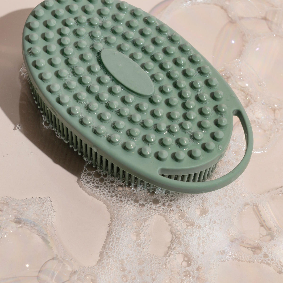 EcoTools scrubber size comparison in hand conveys compact portability