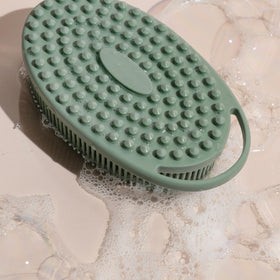 EcoTools scrubber size comparison in hand conveys compact portability