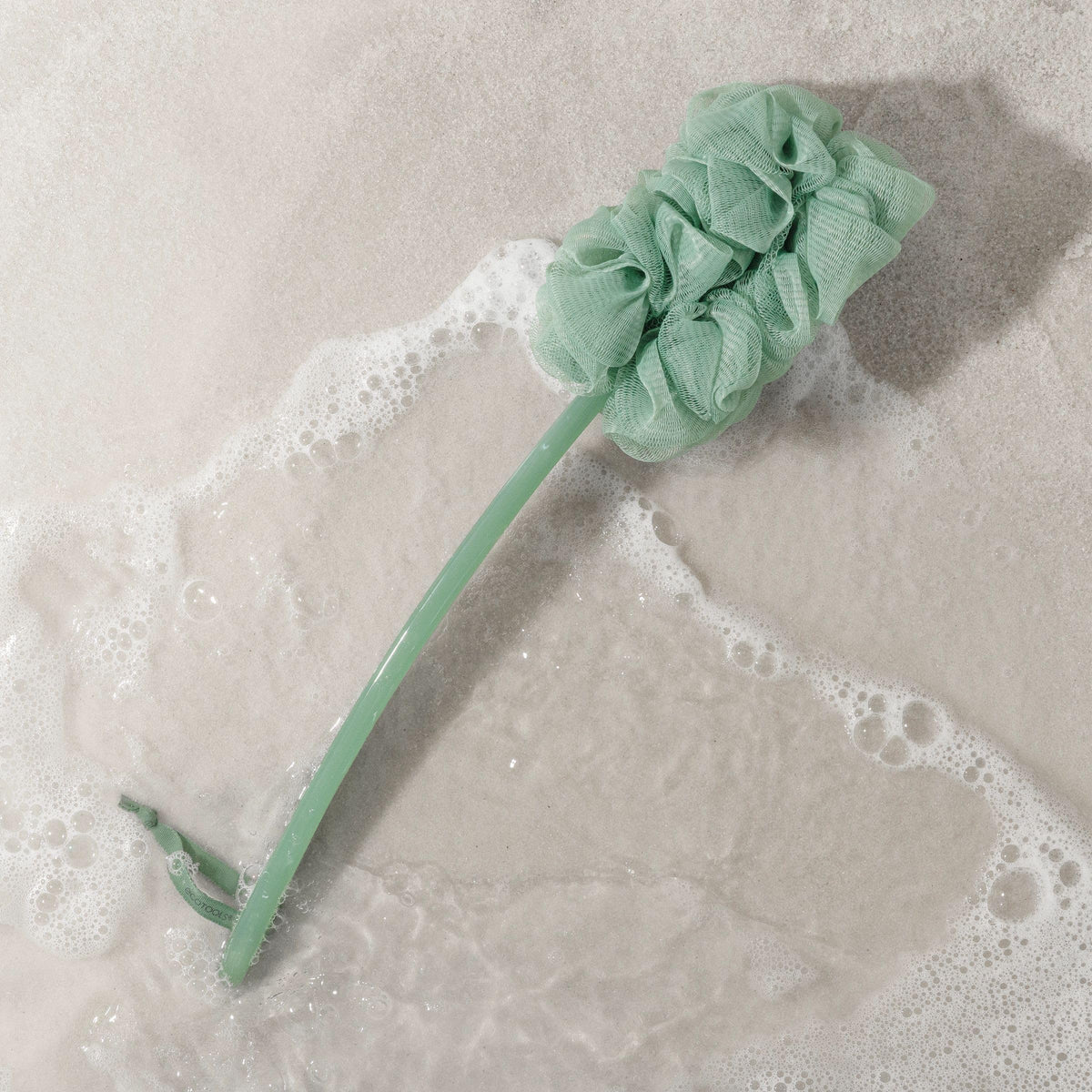 EcoTools Sea Gems being used in shower to create rich lather quickly
