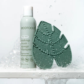 EcoTools pad next to hand showing scale and easy handling for efficient cleaning