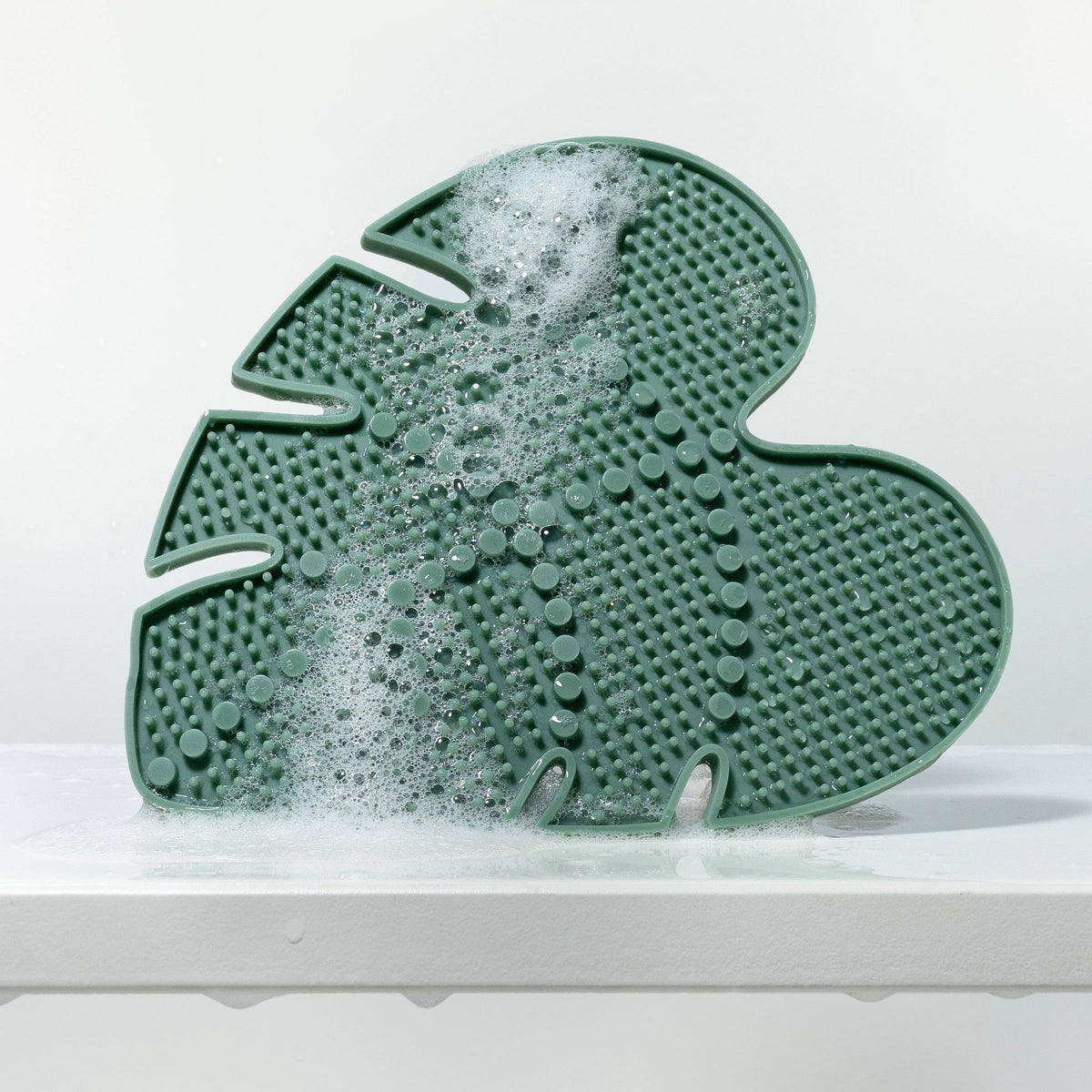 EcoTools pad used to cleanse makeup sponges showing gentle agitation and stain removal