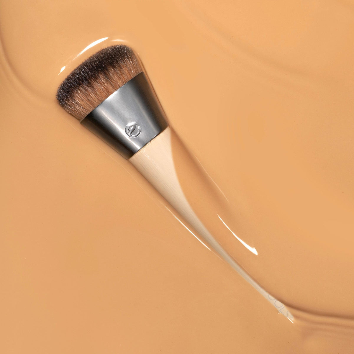 EcoTools brush in-use applying liquid foundation for buildable, streak-free coverage