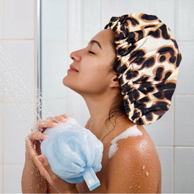 Edoneery leopard in use on long curly hair keeping hairstyle dry during shower