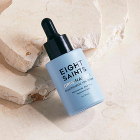 Eight Saints pipette dispensing serum highlighting precise application