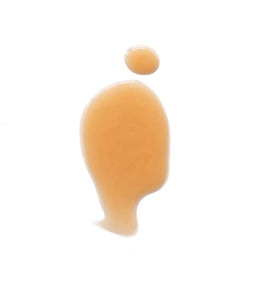 Eight Saints pump dispenser in hand demonstrating size and easy application