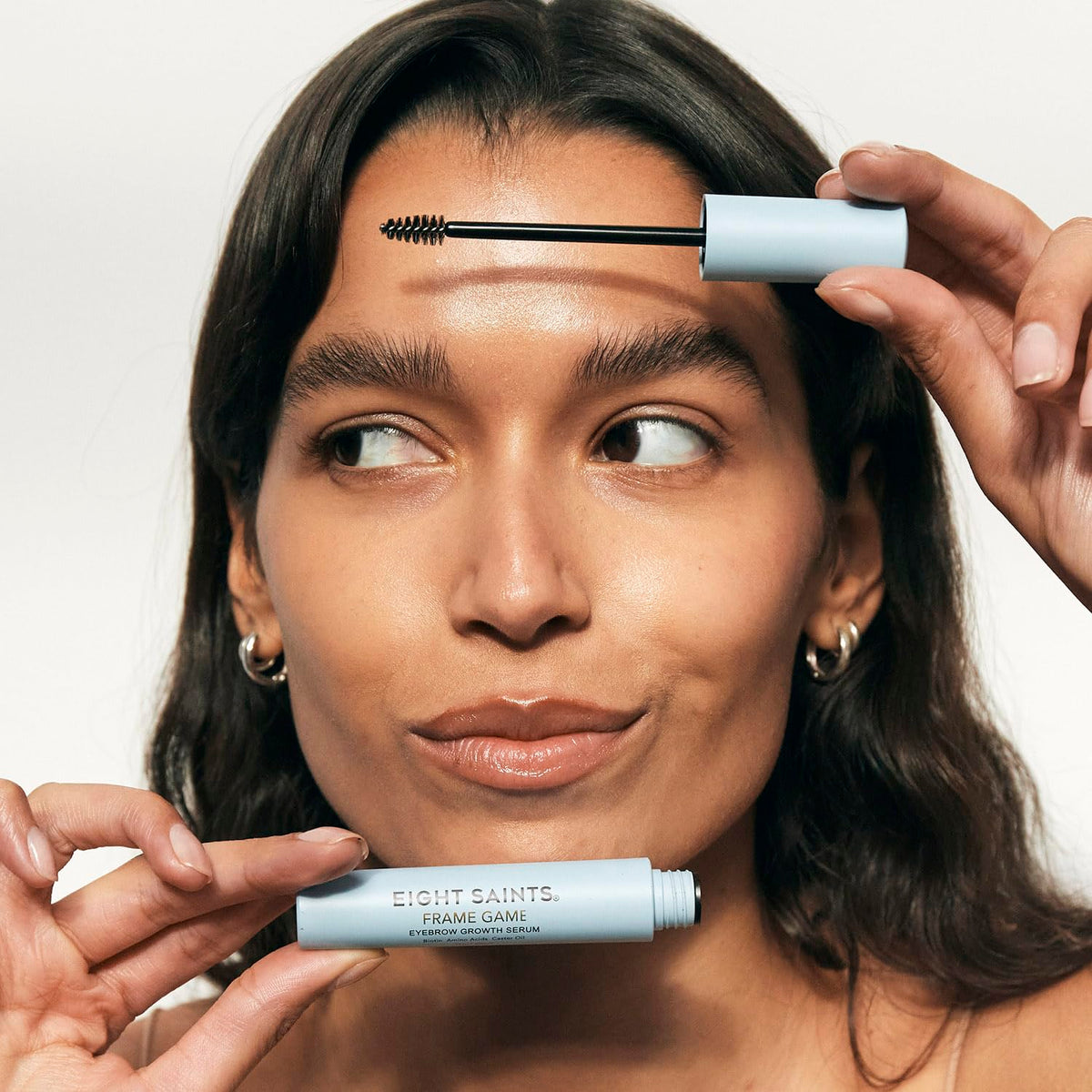 Eight Saints precision applicator close-up delivering targeted brow treatment