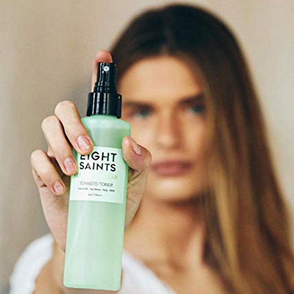 Eight Saints clear toner poured on hand showing lightweight texture