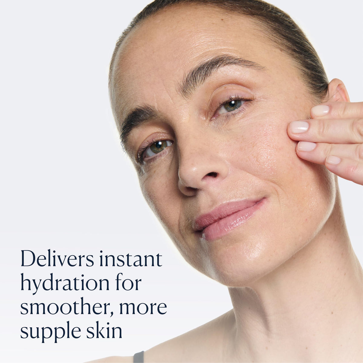 ELEMIS bottle held in hand to show 15ml size for travel-friendly use
