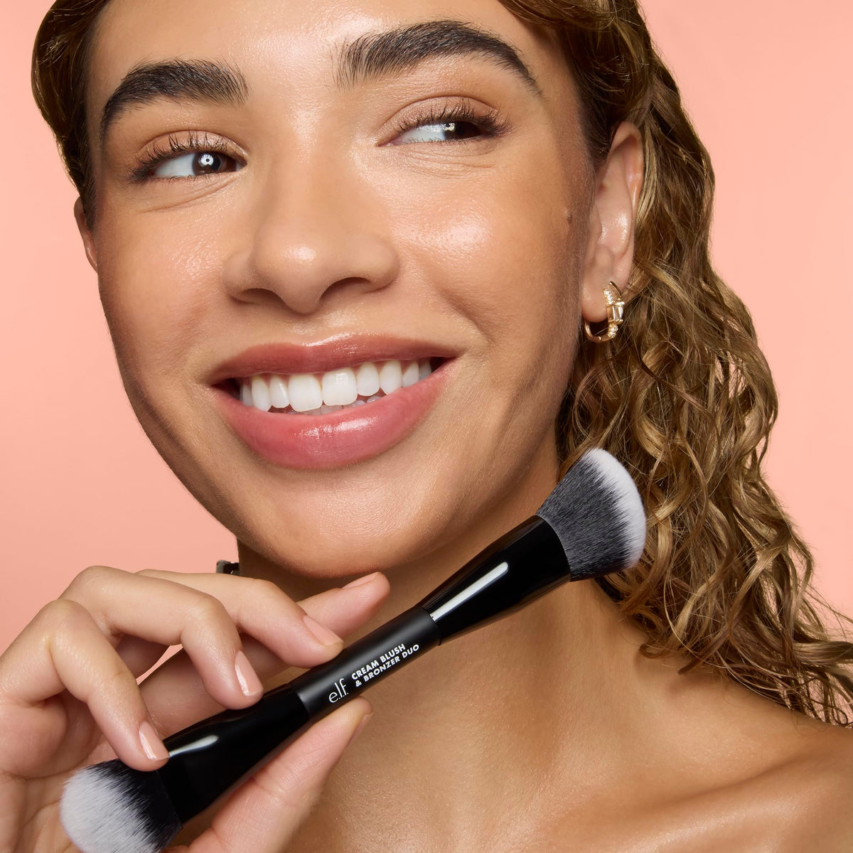 e.l.f. brush blending cream bronzer on cheek demonstrating natural finish