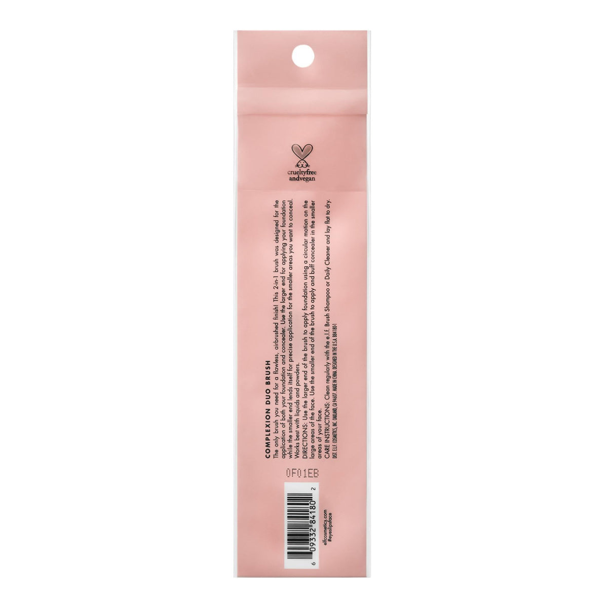 e.l.f. Complexion Duo Brush on a vanity beside makeup for a polished routine setup