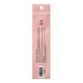 e.l.f. Complexion Duo Brush on a vanity beside makeup for a polished routine setup