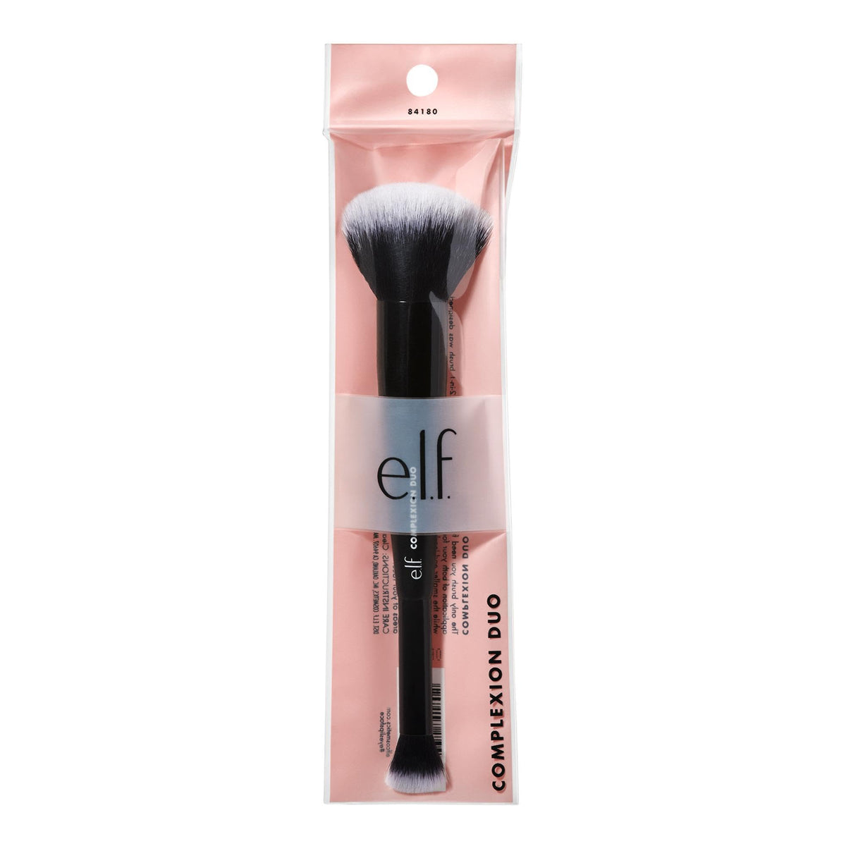 e.l.f. Complexion Duo Brush in hand for scale showing compact travel-friendly size