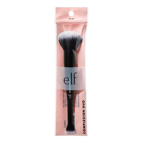 e.l.f. Complexion Duo Brush in hand for scale showing compact travel-friendly size