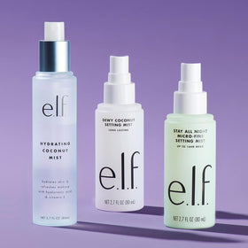 e.l.f. Dewy Coconut next to a hand for scale, shows portable 2.7 fl oz size