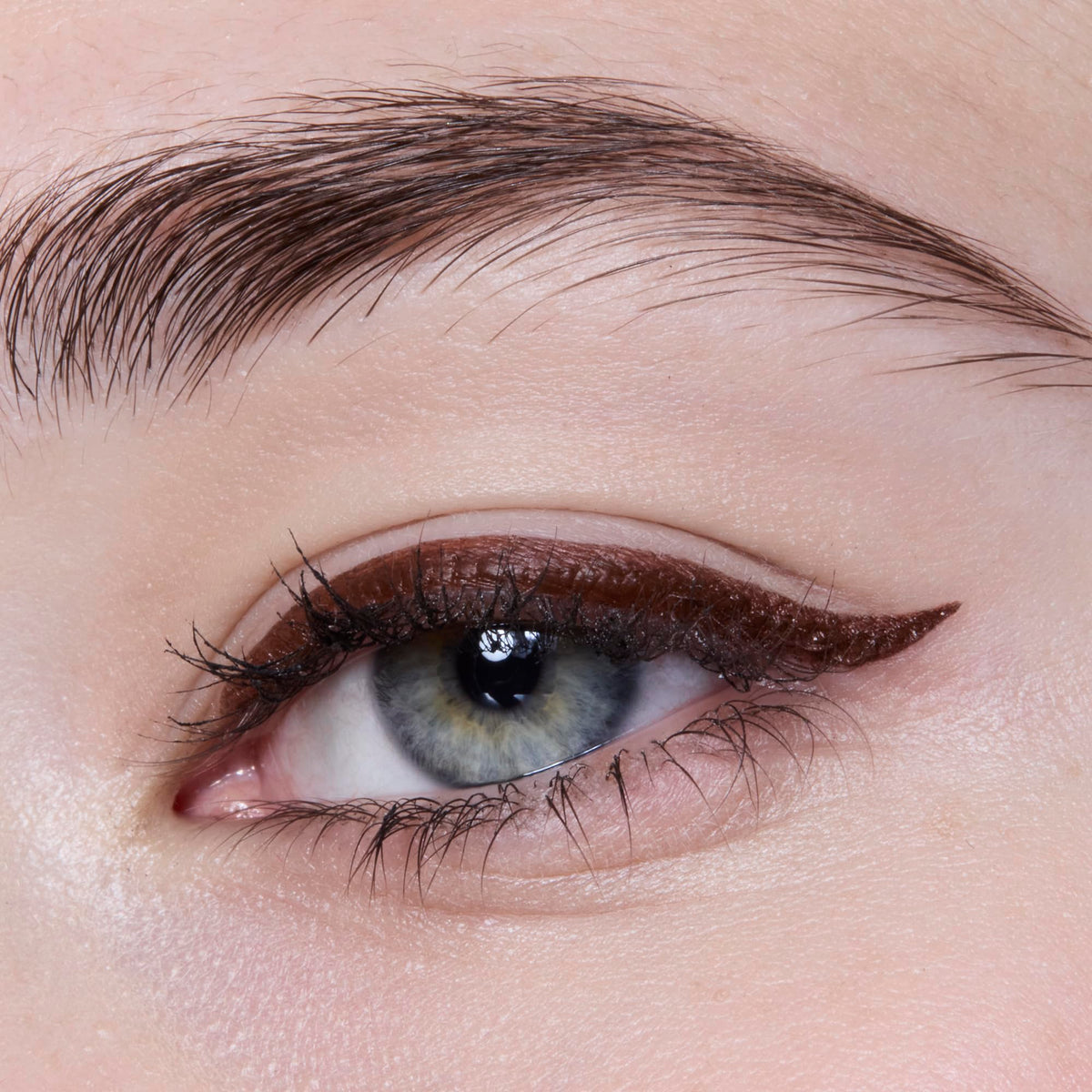 e.l.f. eyeliner pen with cap beside ruler showing compact size