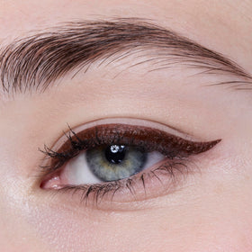 e.l.f. eyeliner pen with cap beside ruler showing compact size