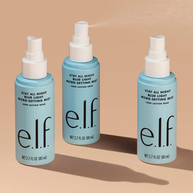 e.l.f. mist on desk near a laptop indicating use while working and blue light-focused routine