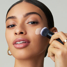 e.l.f. primer blended on hand showing smoothing action and quick absorption benefit