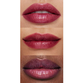 e.l.f. Pout Clout swatch on hand showing sheer plum color payoff