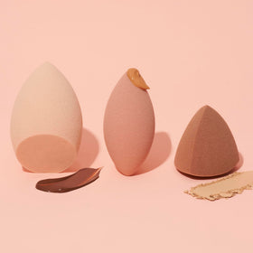 e.l.f. sponges in use blending foundation for streak-free, seamless skin finish