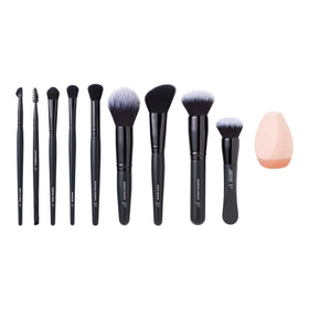 e.l.f. makeup sponge beside brush handle for size comparison and travel convenience