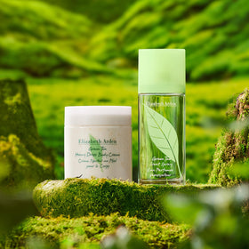 Elizabeth Arden ingredient display with bergamot, lemon and tea leaves conveying freshness