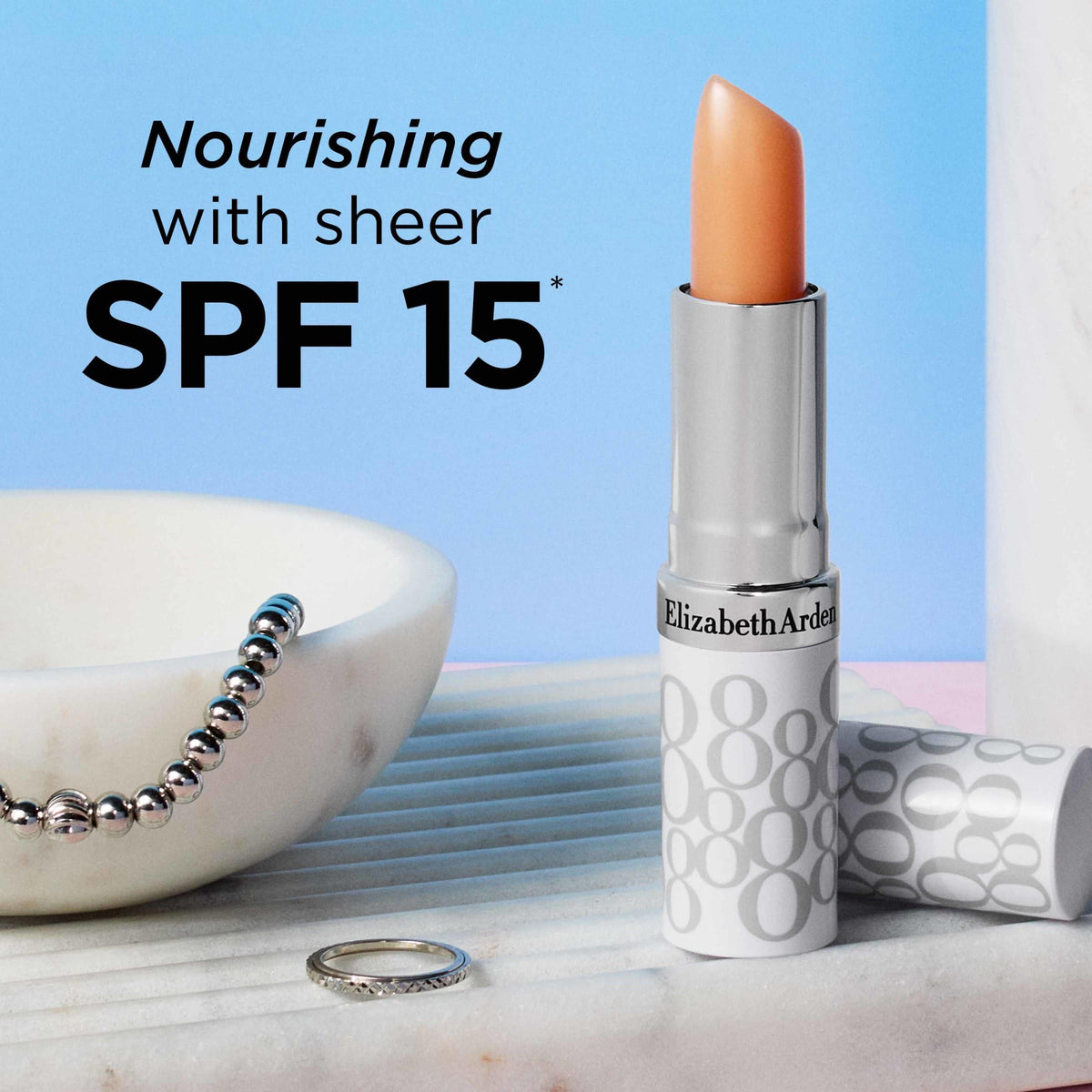 Elizabeth Arden lip stick next to lipstick comparison showing layering compatibility