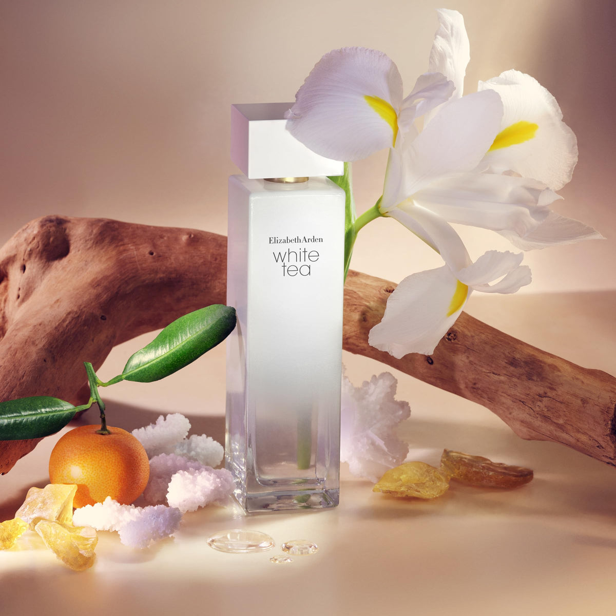 Elizabeth Arden spraying White Tea fragrance demonstrating easy application and quick refresh