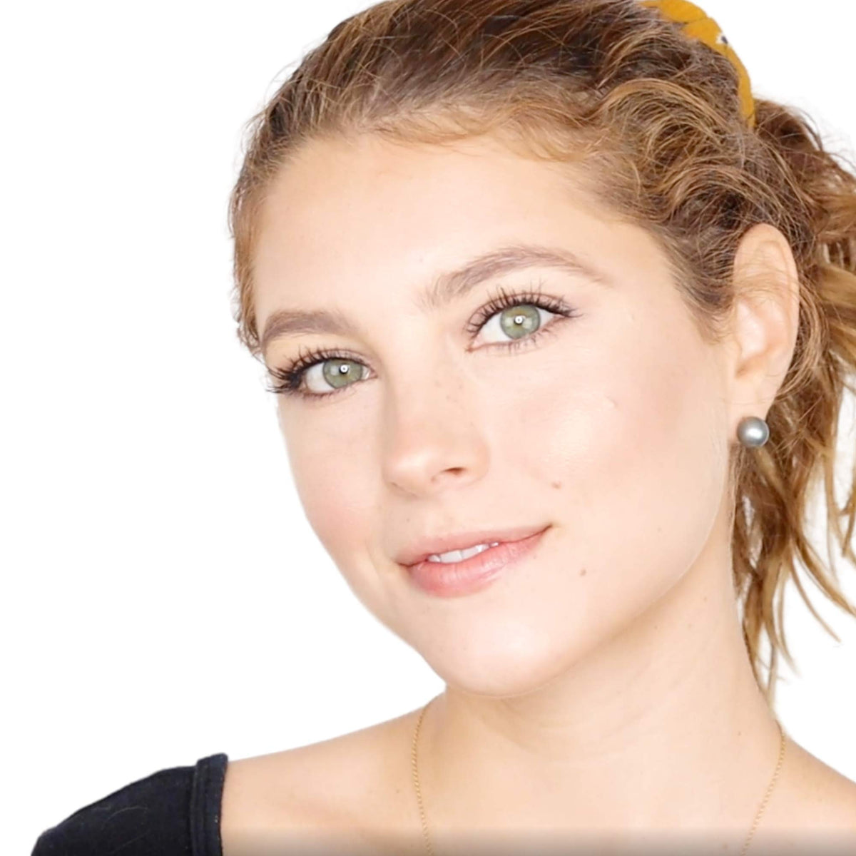 Elizabeth Mott bronzer being applied with brush for precise contouring benefit