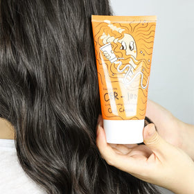 Elizavecca on bathroom shelf styled for daily curl-care routine