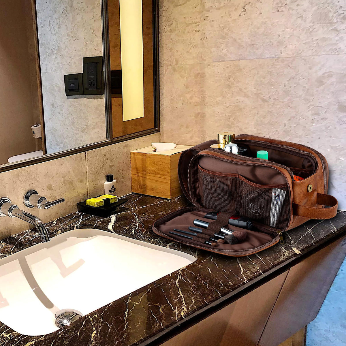 Elviros bag beside toothbrush and travel bottle to show compact, travel-friendly size