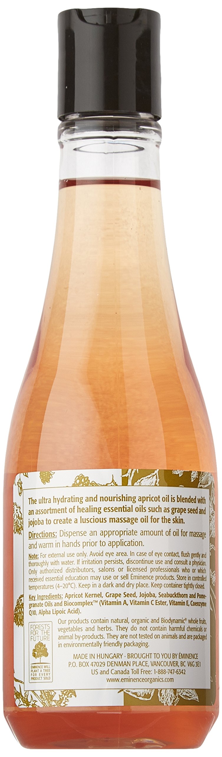 Eminence apricot body oil in hand being applied to skin for soft, flexible moisture
