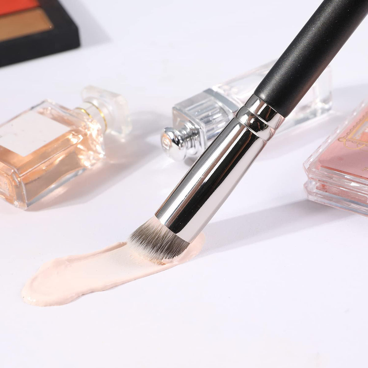 ENERGY brush applying concealer under-eye for crease-free coverage