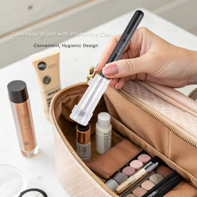 ENERGY brush next to coin showing compact size and easy storage