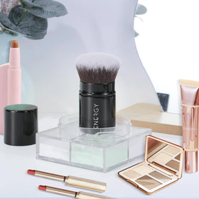 ENERGY kabuki brush inside a travel case illustrating tidy storage and mess prevention