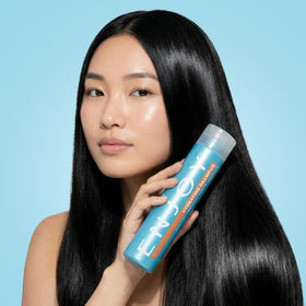 Enjoy lifestyle shot in bathroom with styled hair showcasing manageability benefit